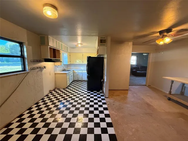 a room with a black white checkered floor with a black white checkered floor