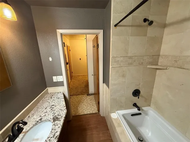a bathroom with a sink and a shower