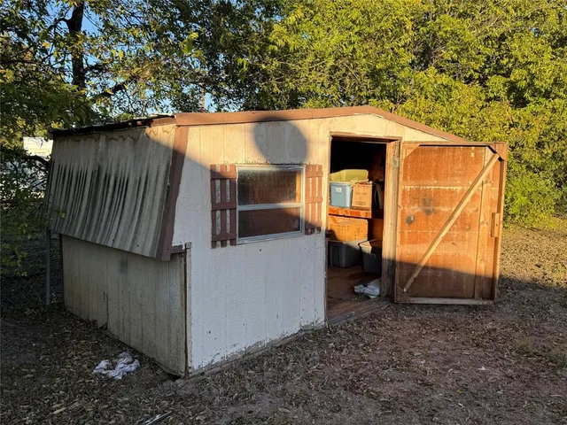 a backyard of a house with yard and outdoor seating