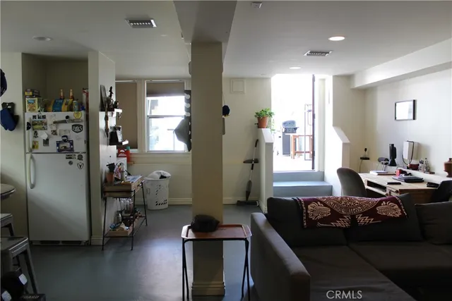 a kitchen with a cabinets a sink and a stove