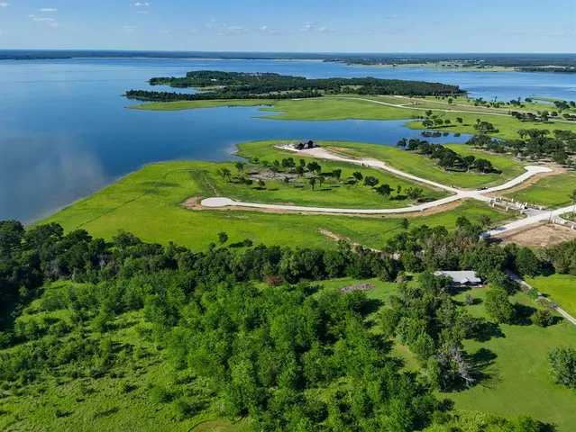 a view of a lake with a big yard