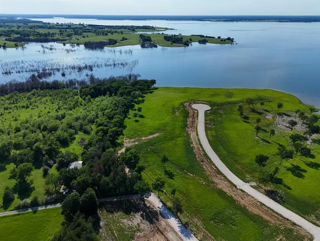 a view of a lake with a big yard