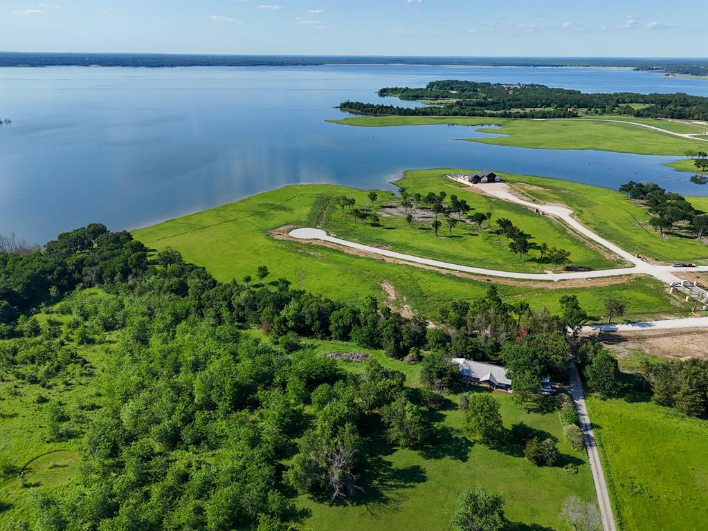 399 Harborside Terrace Windom, TX 75492 - Photo 10 of 36 a view of a water pond with green yard