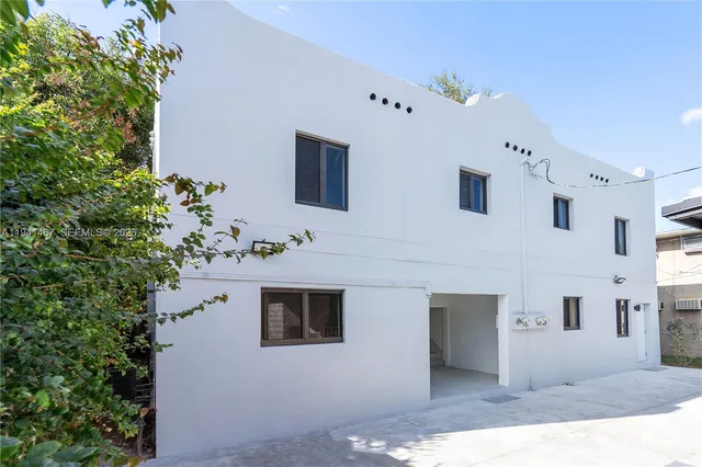 a front view of a house with yard