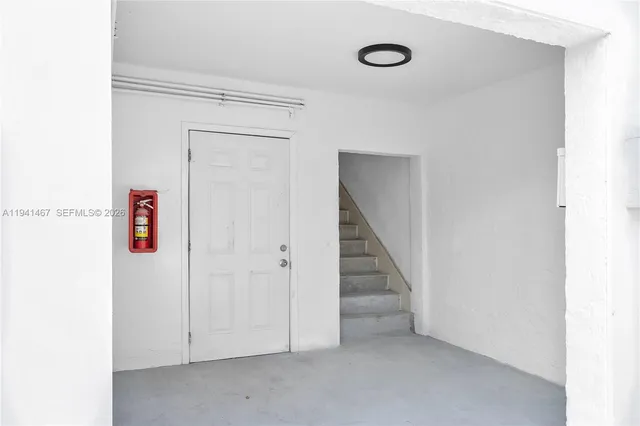 a view of a hallway with staircase