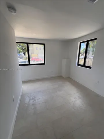 an empty room with windows