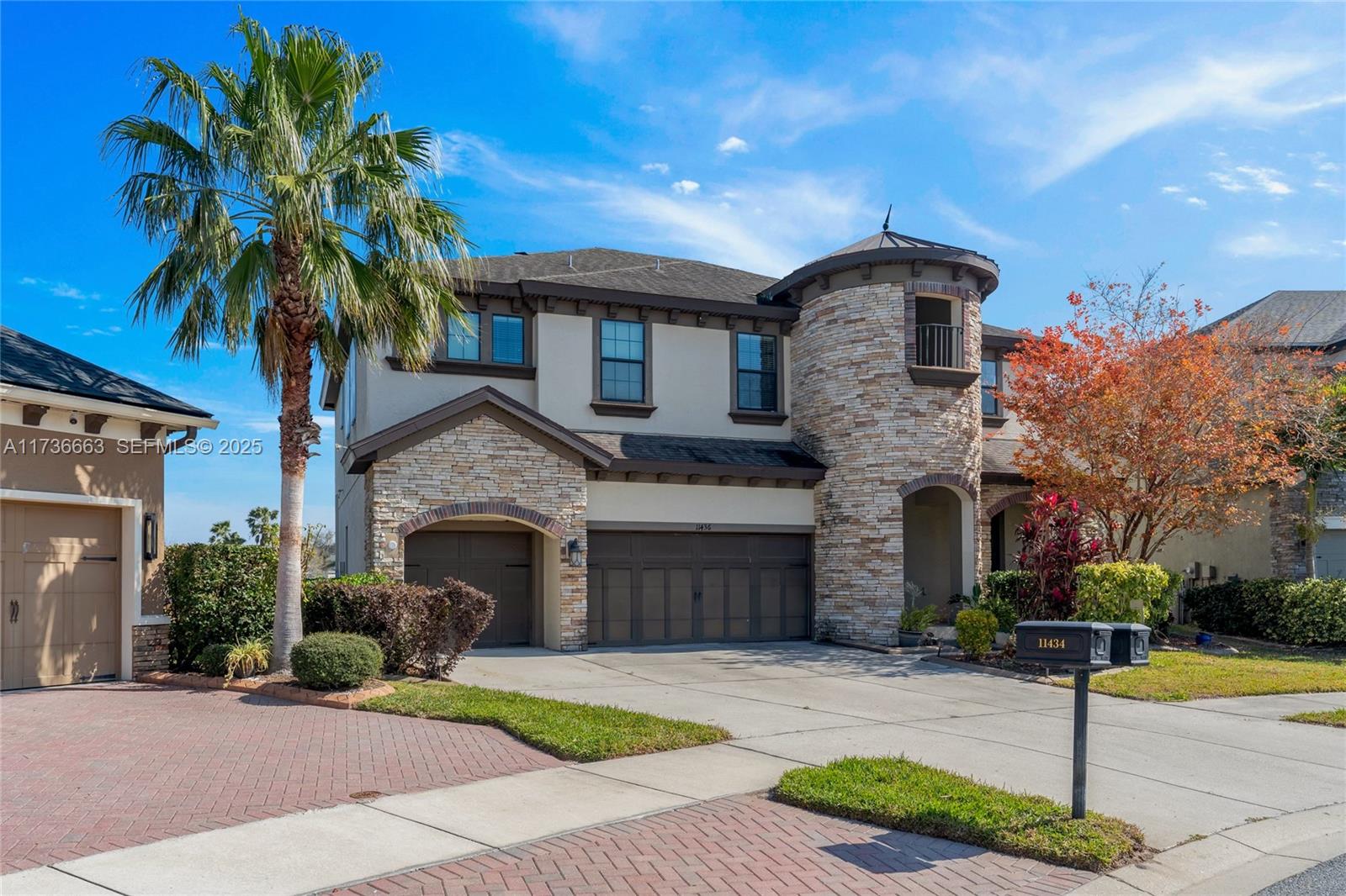 11436 Drifting Leaf Drive Riverview, FL 33579 - Photo 2 of 21 a front view of a house with a yard and garage