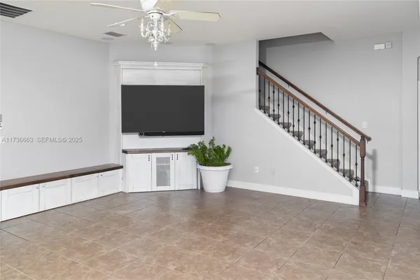 a view of a living room and a flat screen tv