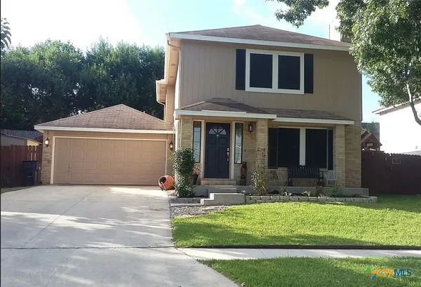 a front view of house with yard