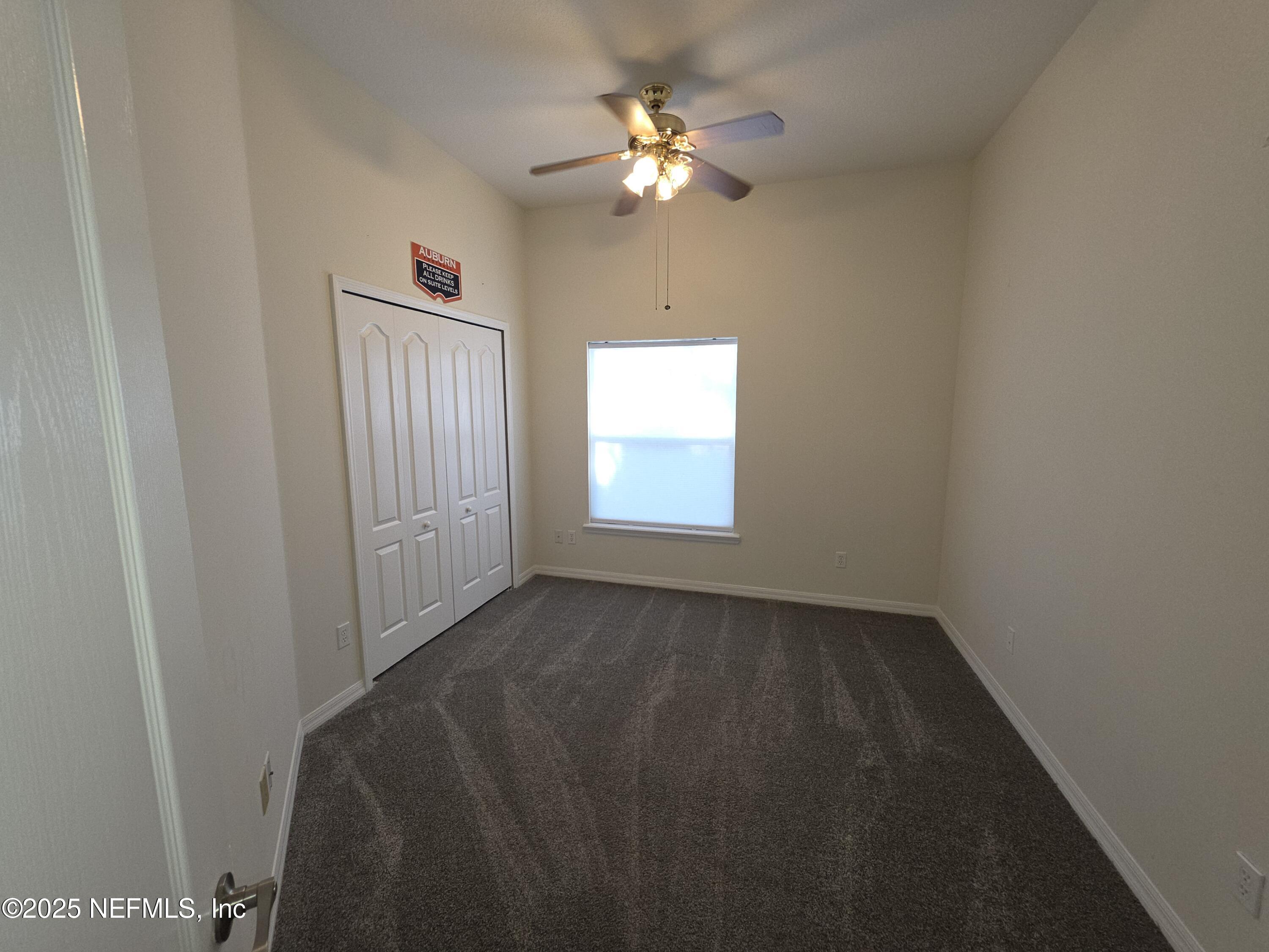 1713 Austin Lane St. Augustine, FL 32092 - Photo 11 of 12 a view of an empty room and chandelier fan