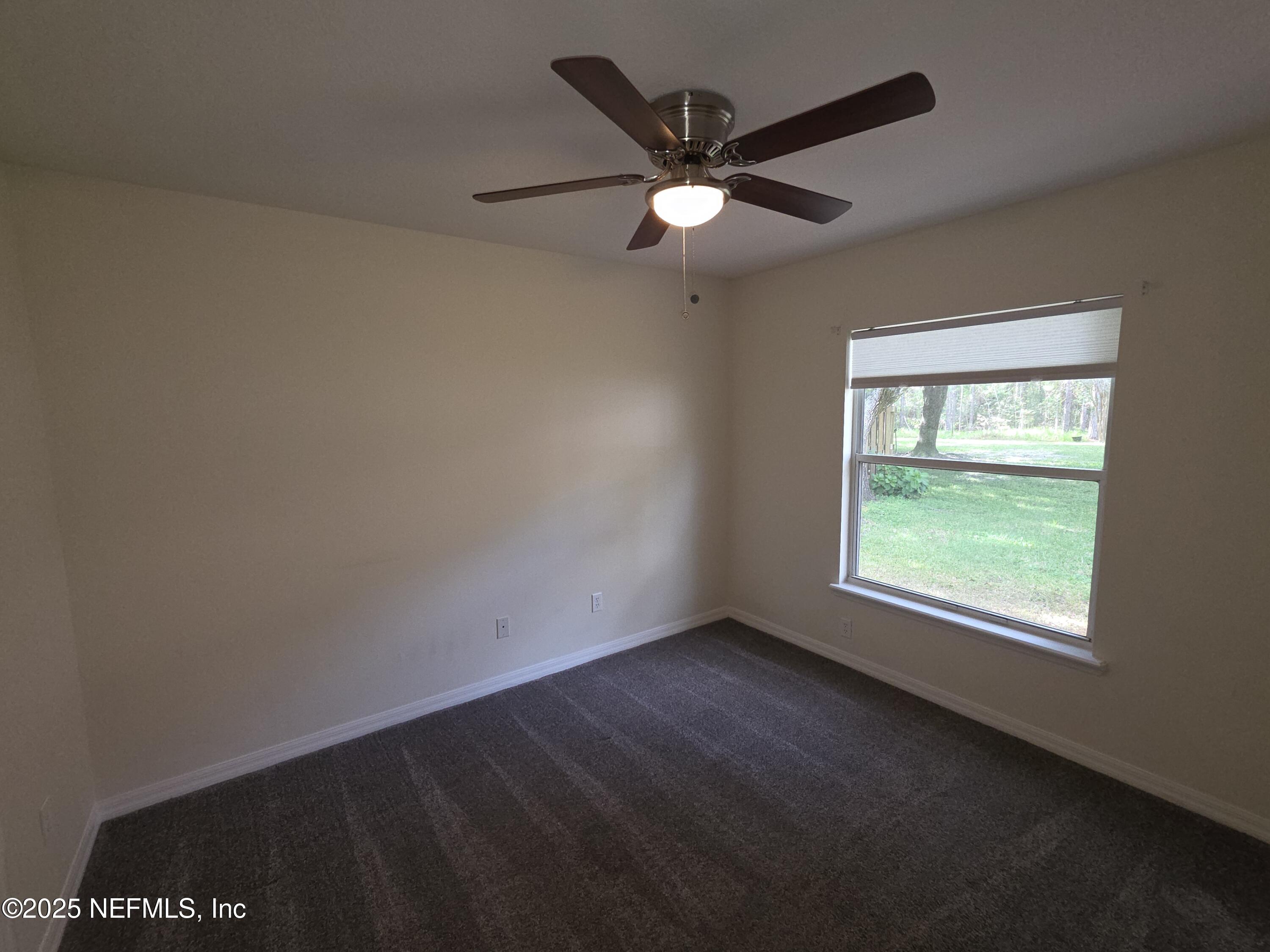 1713 Austin Lane St. Augustine, FL 32092 - Photo 8 of 12 a view of an empty room with a window