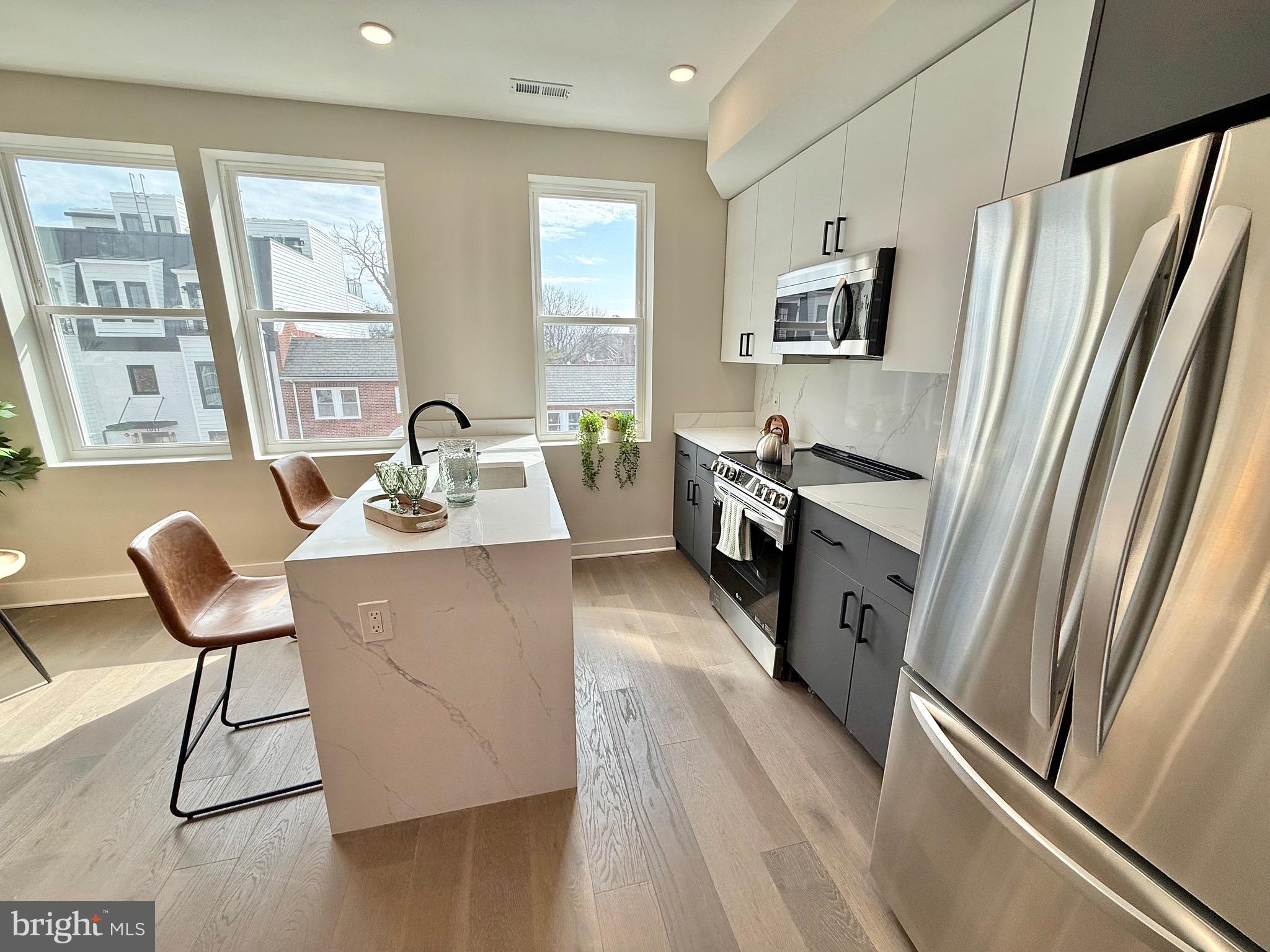 1004 18th Street Northeast, Unit 6 Washington, DC 20002 - Photo 6 of 9 a living room with furniture and a refrigerator
