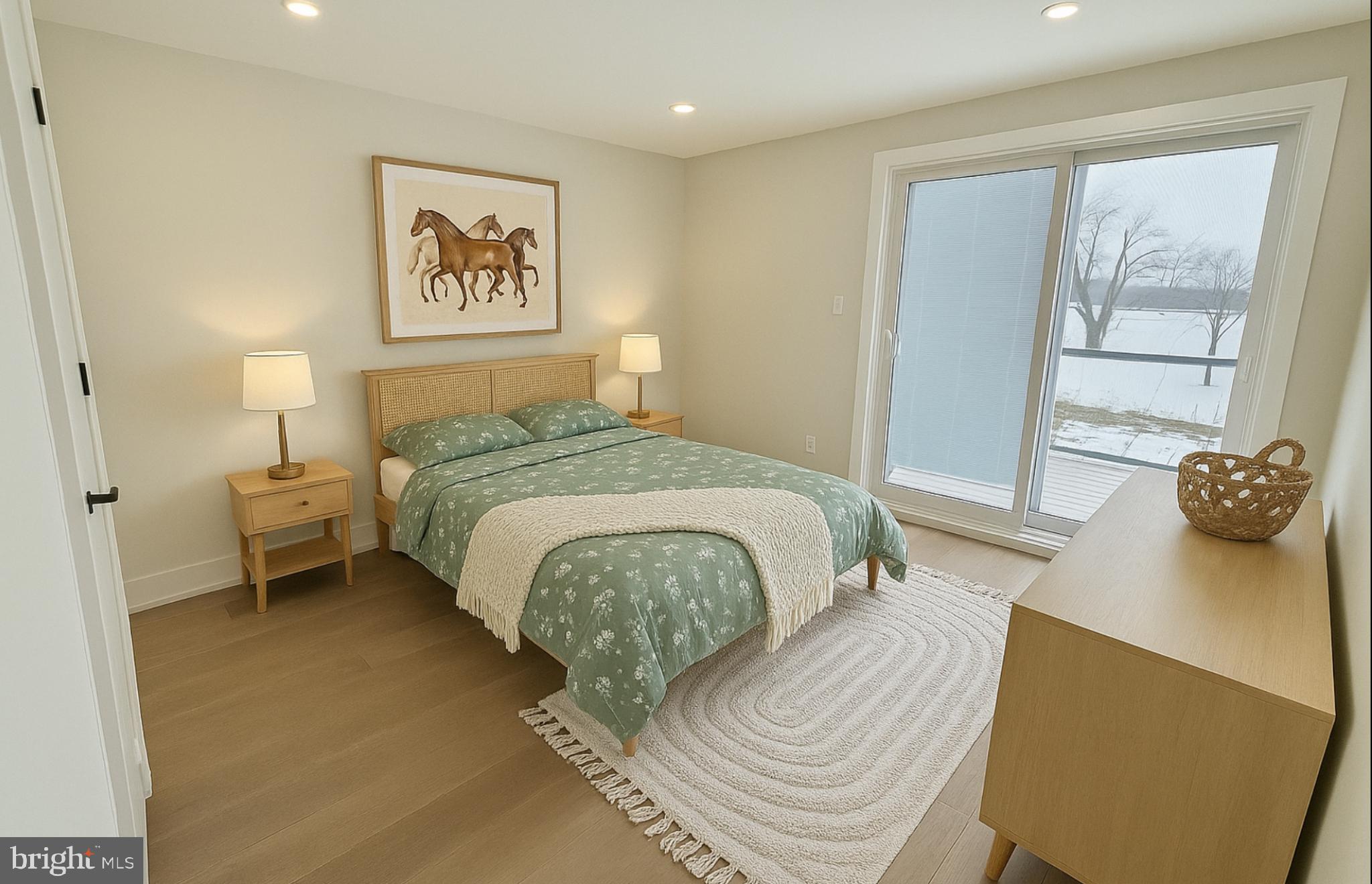 1004 18th Street Northeast, Unit 6 Washington, DC 20002 - Photo 7 of 9 a bedroom with a bed and wooden floor
