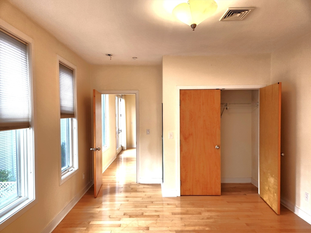 24 Bay State Road, Unit 11 Cambridge, MA 02138 - Photo 15 of 26 a view of a big room with windows and entryway