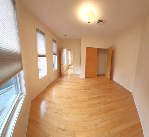a bathroom with a granite countertop toilet a sink and a bathtub