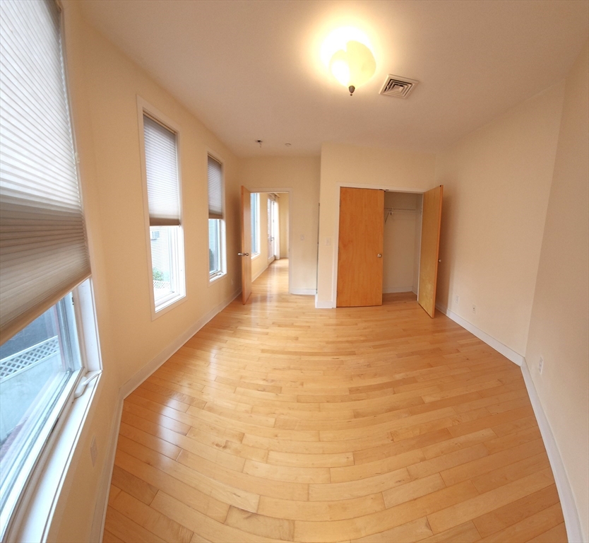 24 Bay State Road, Unit 11 Cambridge, MA 02138 - Photo 16 of 26 a view of an empty room and window
