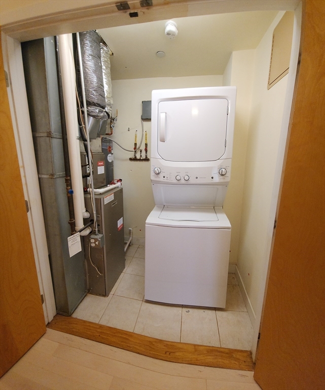 24 Bay State Road, Unit 11 Cambridge, MA 02138 - Photo 22 of 26 a bathroom with a toilet and a mirror
