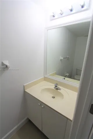 a bathroom with a sink and mirror
