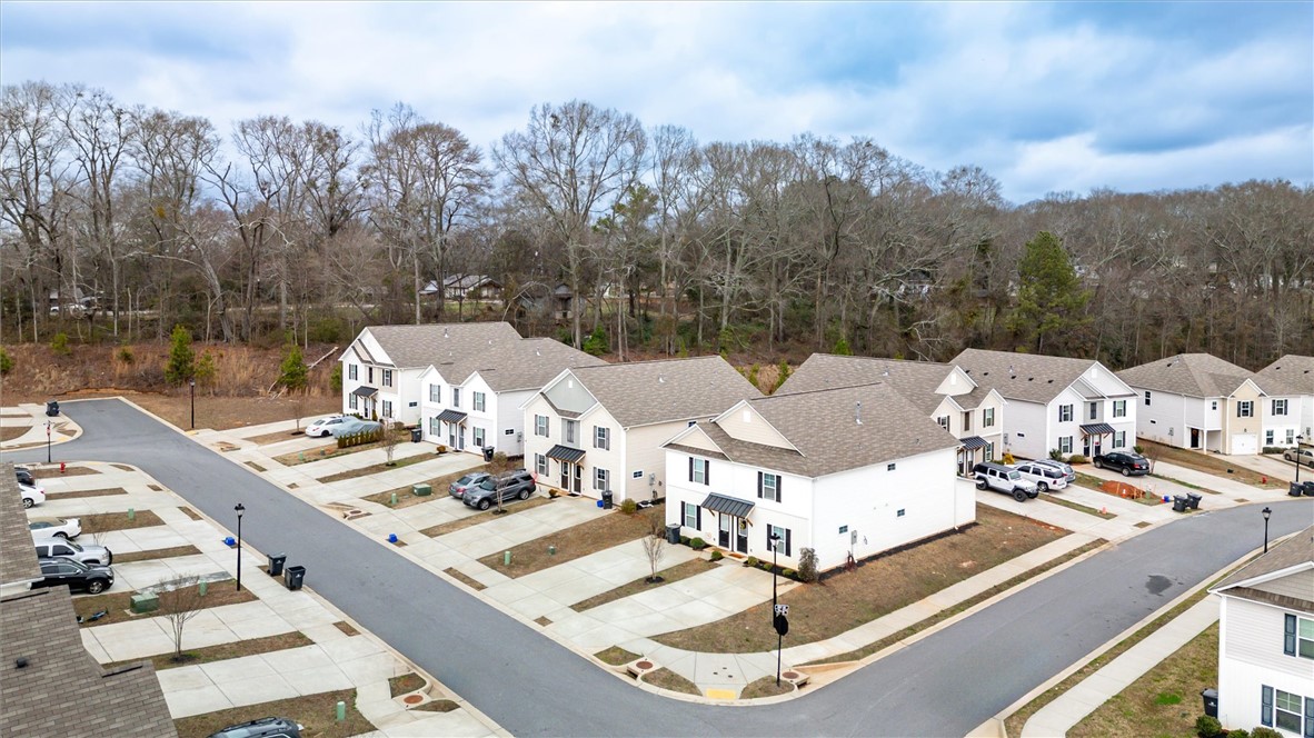215 Royal Way Pendleton, SC 29670 - Photo 26 of 33 An aerial view captures a quiet neighborhood with modern homes and ample parking.