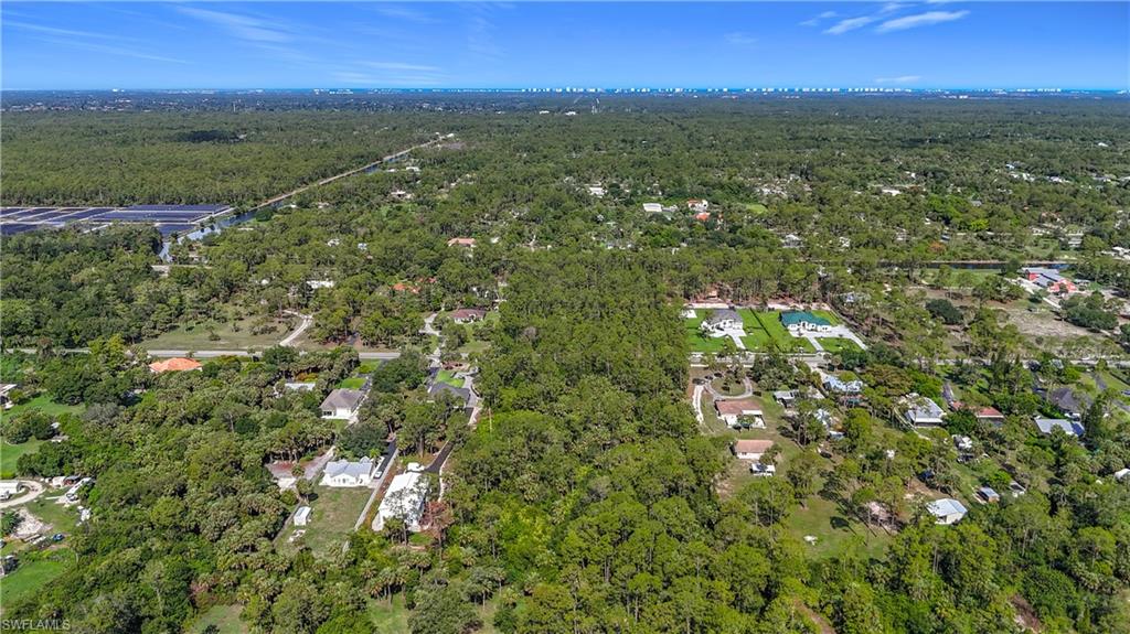23rd Street Southwest Naples, FL 34117 - Photo 15 of 17 View of property location featuring a forest