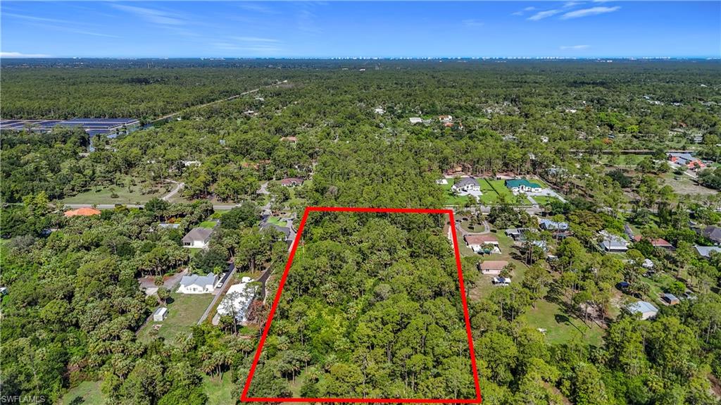 23rd Street Southwest Naples, FL 34117 - Photo 17 of 17 Aerial view of property's location featuring a forest and property boundaries highlighted