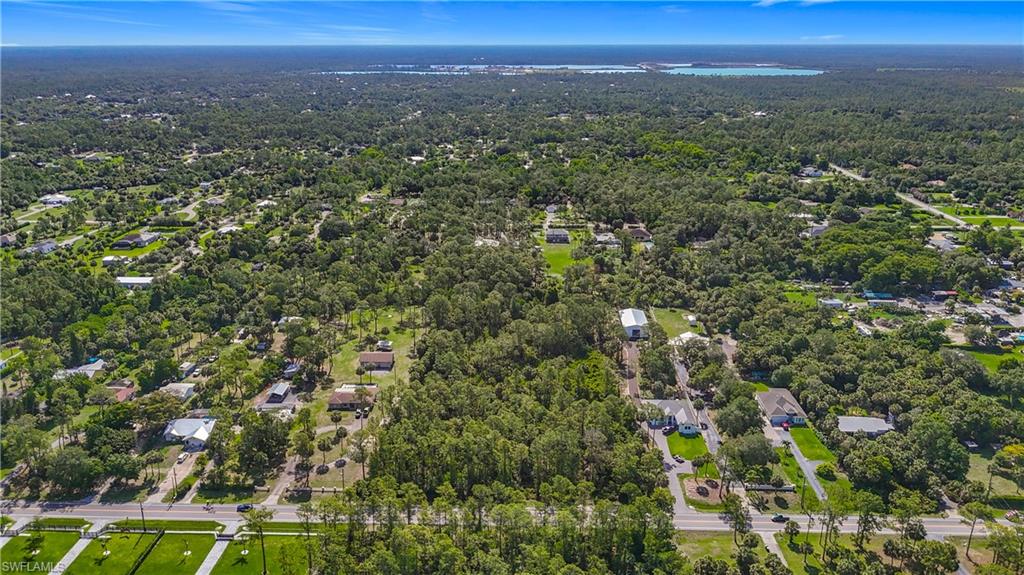 23rd Street Southwest Naples, FL 34117 - Photo 4 of 17 View of property location featuring a heavily wooded area