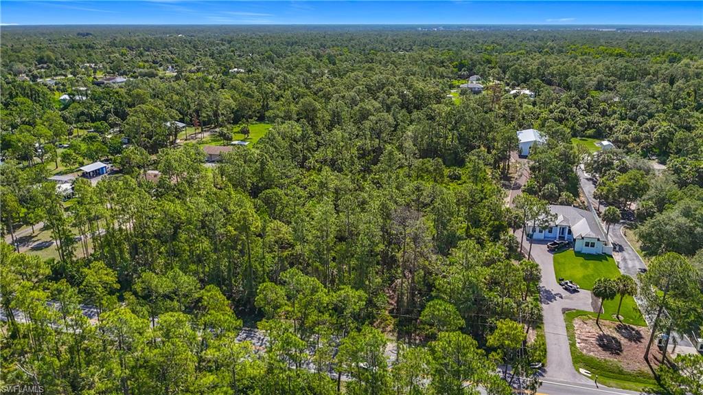 23rd Street Southwest Naples, FL 34117 - Photo 7 of 17 Drone / aerial view of a heavily wooded area