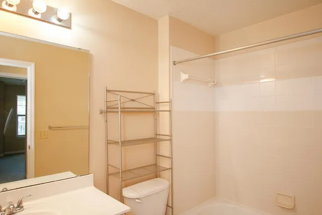 a bathroom with a bathtub and a shower