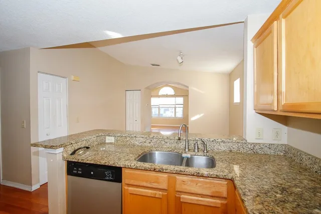 a view of a lake with houses in the back