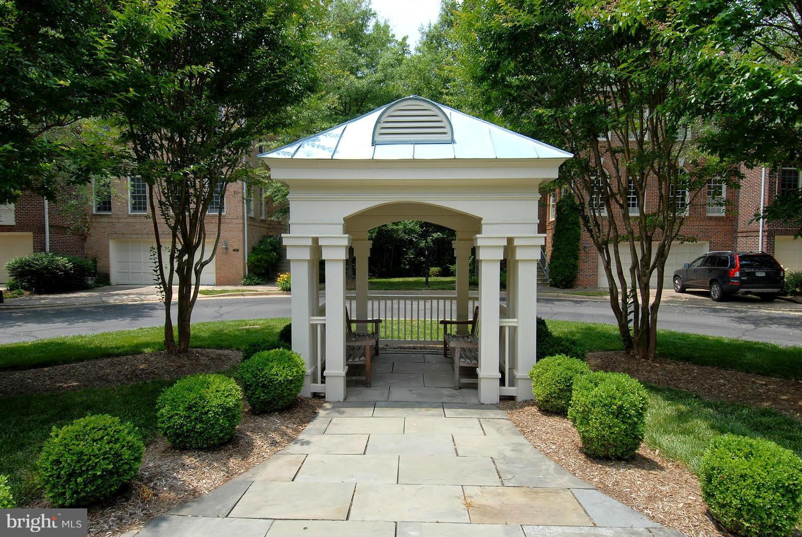 144 Rees Place Falls Church, VA 22046 - Photo 3 of 27 a front view of a house with garden