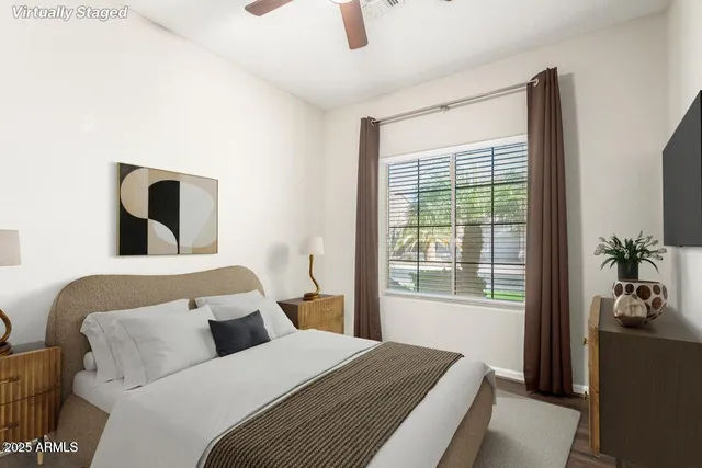 a bedroom with a bed lamp and window