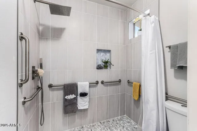 a bathroom with a bathtub and shower