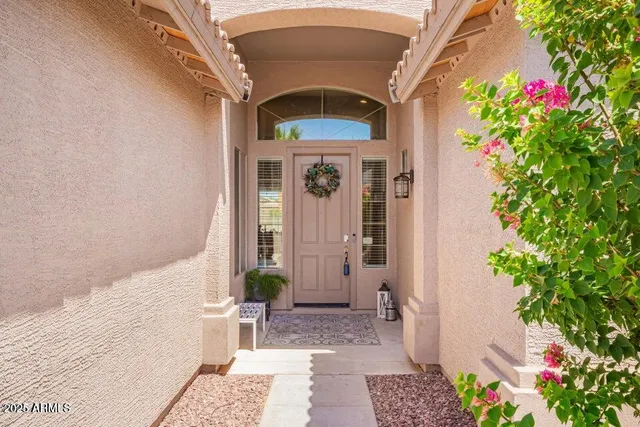 a front view of a house with a blue gate