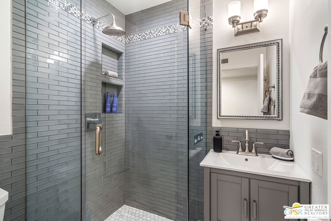 2029 Ramitas Way Palm Springs, CA 92264 - Photo 12 of 41 a bathroom with a sink vanity granite and a mirror