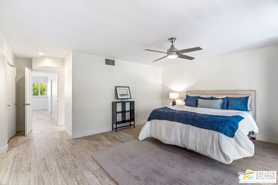 2029 Ramitas Way Palm Springs, CA 92264 - Photo 18 of 41 a bedroom with a bed and a ceiling fan