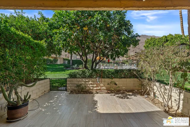 a view of yard with patio