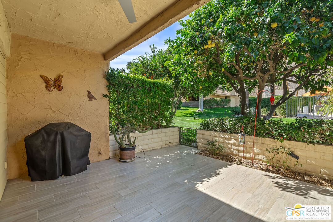 2029 Ramitas Way Palm Springs, CA 92264 - Photo 29 of 41 a view of a chairs and table in the patio with a fire pit