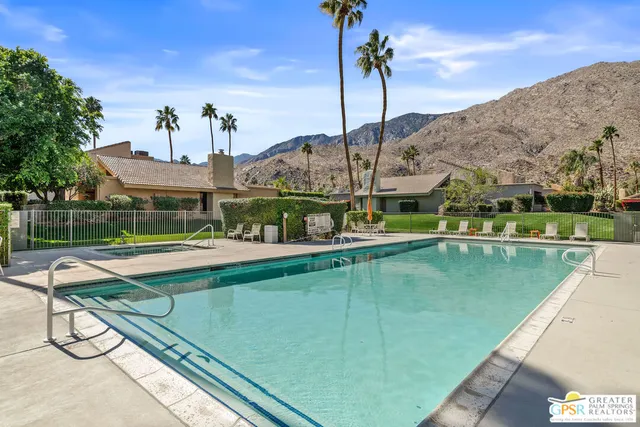 a view of a swimming pool with a lake view