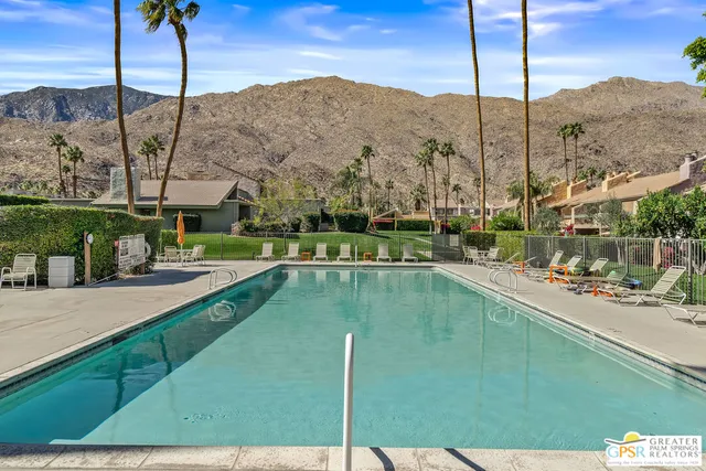 a view of a swimming pool with a balcony