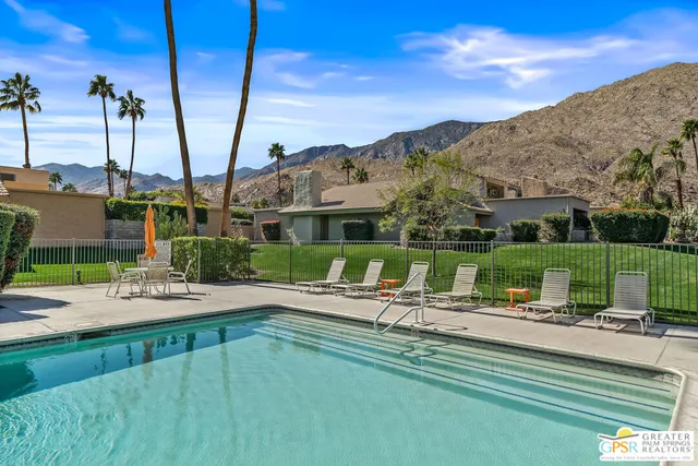 a view of a swimming pool with a patio