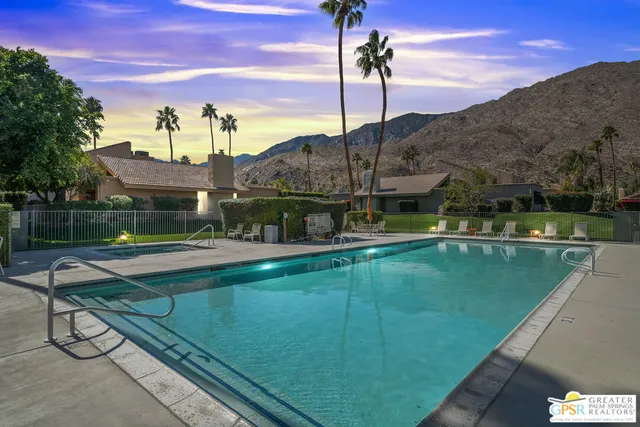a view of swimming pool with a patio