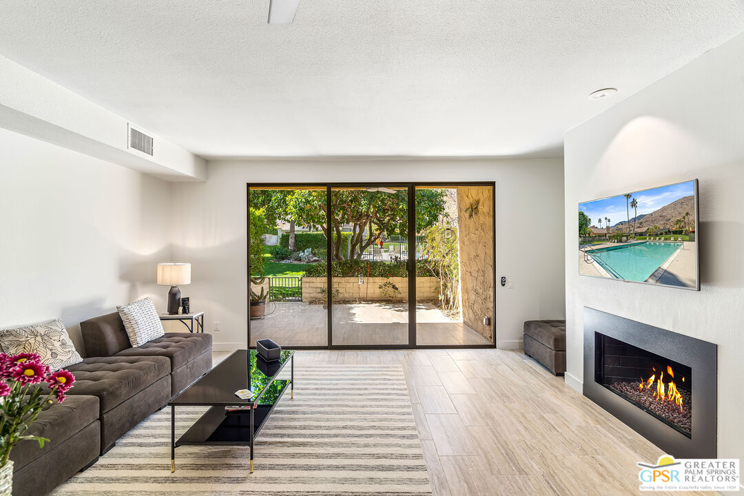 2029 Ramitas Way Palm Springs, CA 92264 - Photo 8 of 41 a living room with furniture and a fireplace