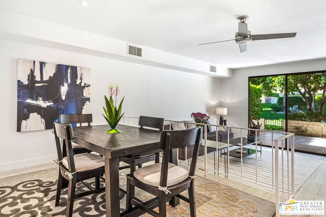 a view of a dining room with furniture window and outside view