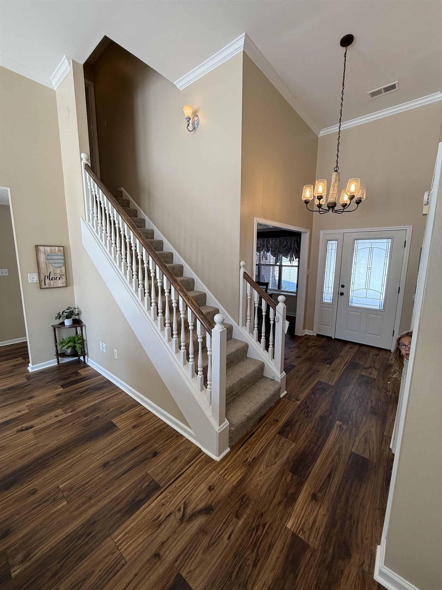3415 Chambers Road Millington, TN 38053 - Photo 4 of 27 Entrance foyer with a high ceiling, a chandelier, dark wood-type flooring, and crown molding