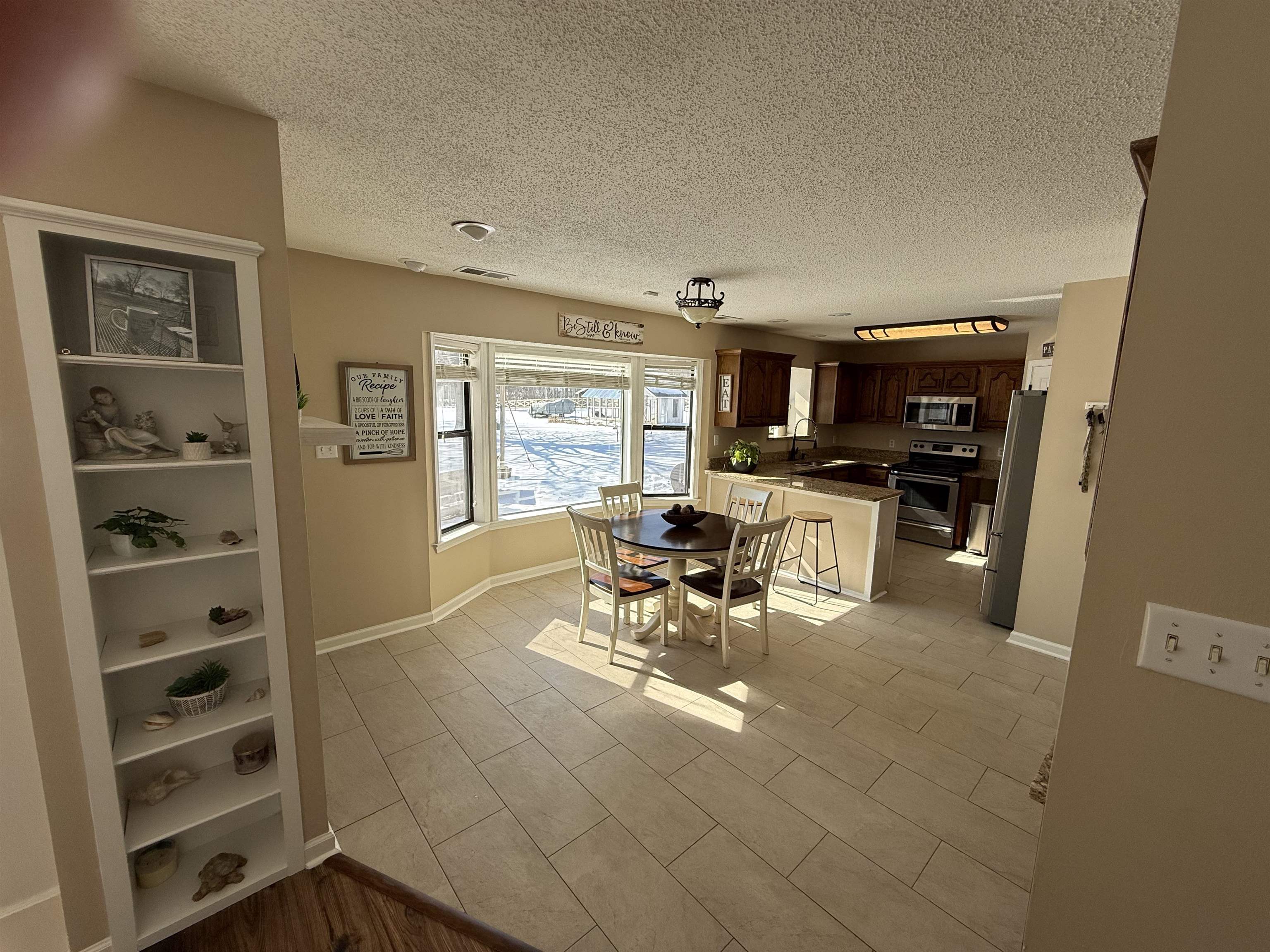3415 Chambers Road Millington, TN 38053 - Photo 8 of 27 Dining space with light tile patterned floors and a textured ceiling