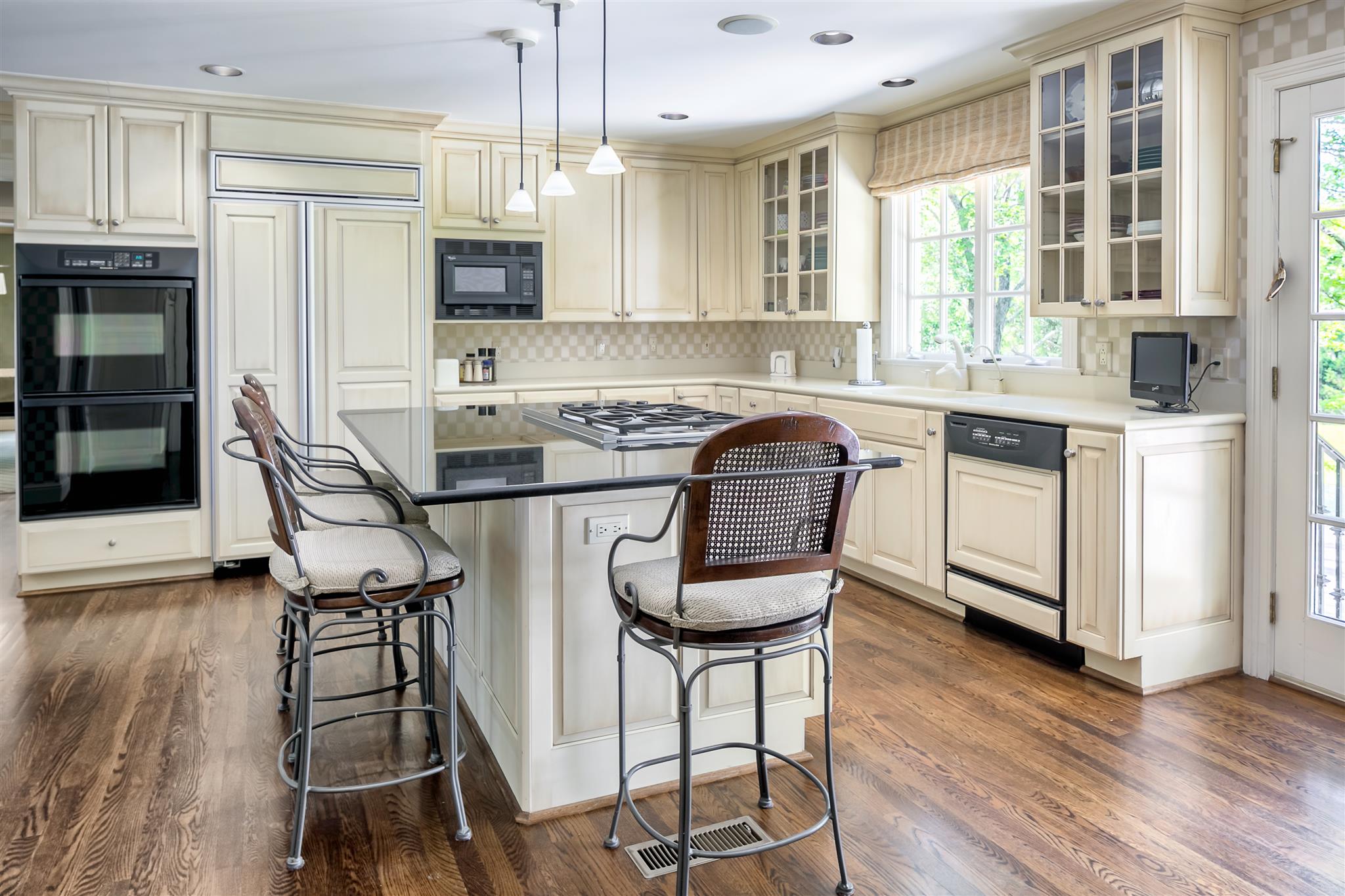 4508 Murfreesboro Road Franklin, TN 37067 - Photo 14 of 30 a kitchen with stainless steel appliances a stove a sink refrigerator and cabinets