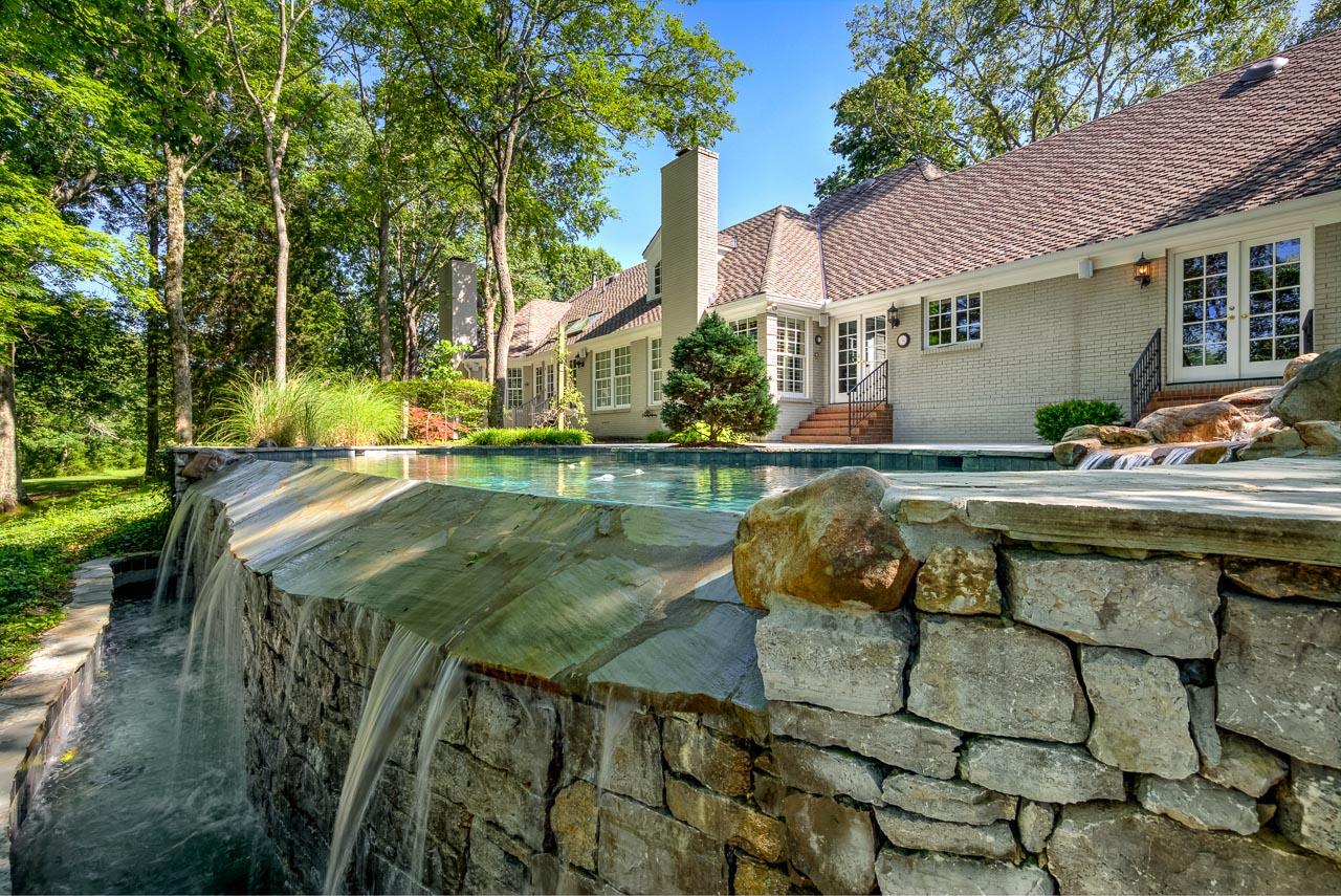 4508 Murfreesboro Road Franklin, TN 37067 - Photo 2 of 30 a view of backyard with swimming pool and outdoor seating