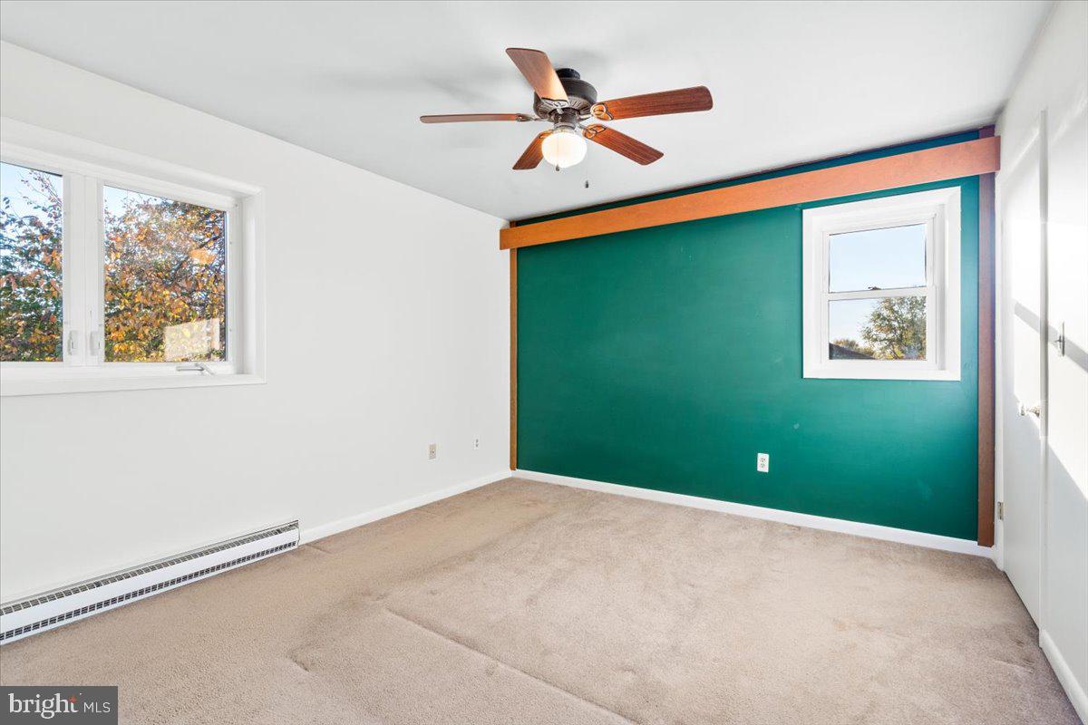 6936 Linganore Road Frederick, MD 21701 - Photo 20 of 33 a view of room with window and ceiling fan