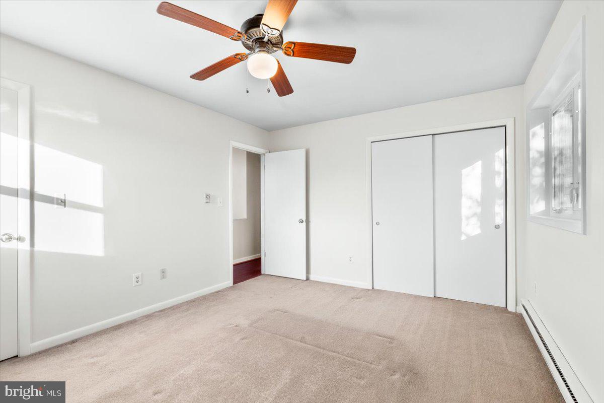 6936 Linganore Road Frederick, MD 21701 - Photo 21 of 33 a view of an empty room with a window