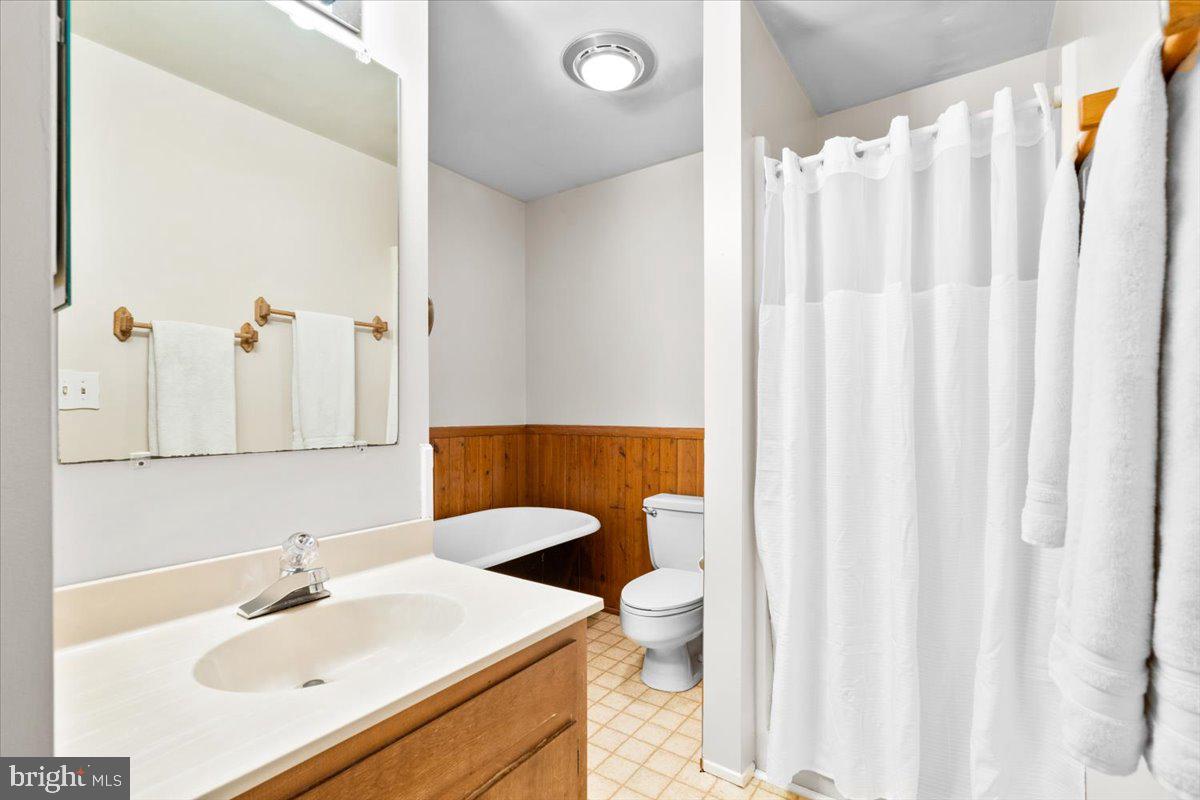 6936 Linganore Road Frederick, MD 21701 - Photo 24 of 33 a bathroom with a sink toilet and shower